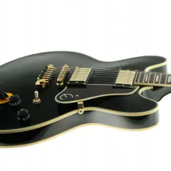 Czarna gitara Lucille z złotymi elementami, gotowa do rockowych riffów.