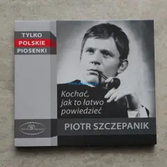 Piotr Szczepanik na okładce płyty "Tylko polskie piosenki". Wizerunek artysty z fajką i tytułem "Kochać, jak to łatwo powiedzieć".